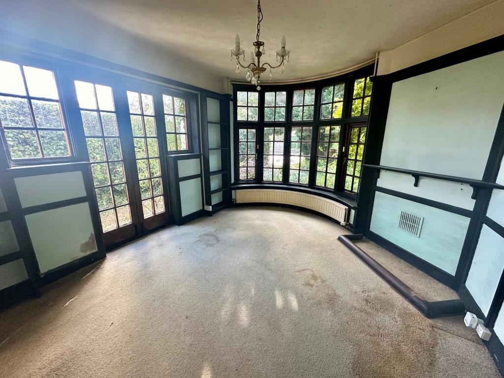 Lot: 129 - FOUR-BEDROOM DETACHED HOUSE FOR REFURBISHMENT - Living room with bay window
